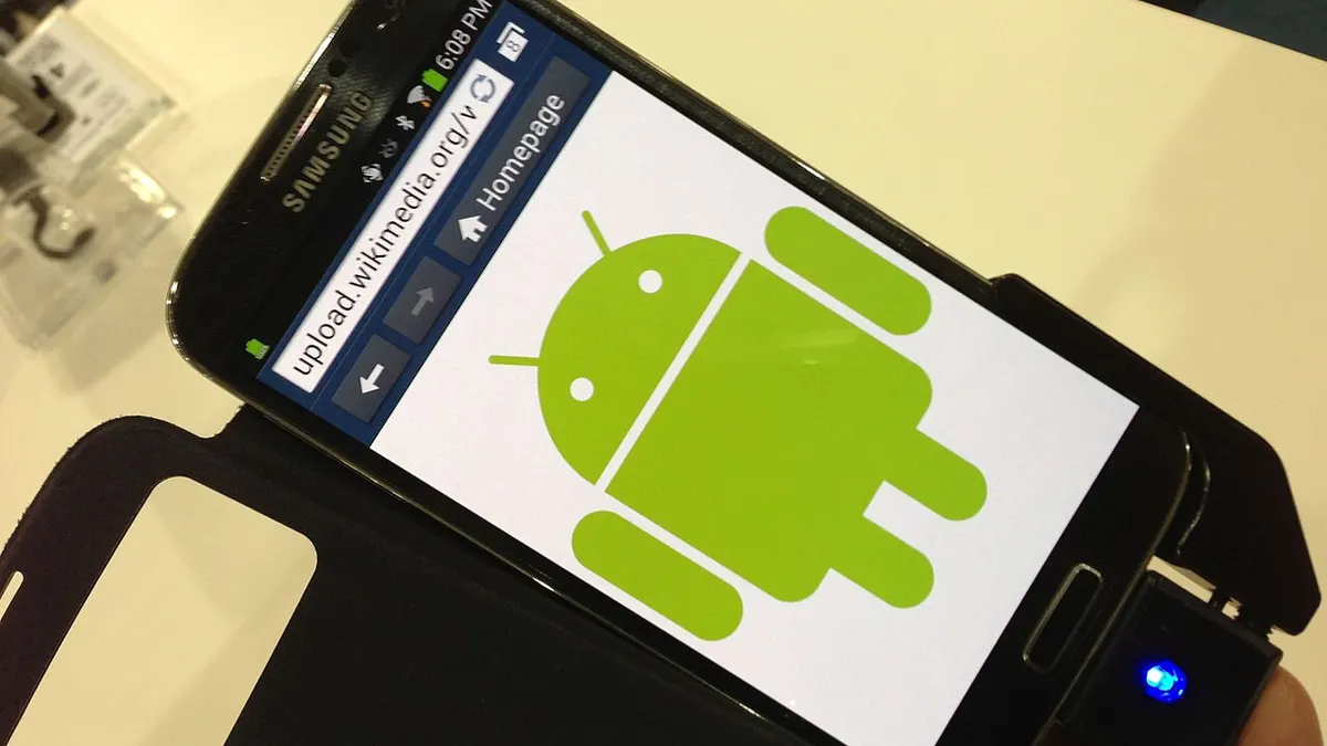 A smartphone showing the Android robot icon on its screen